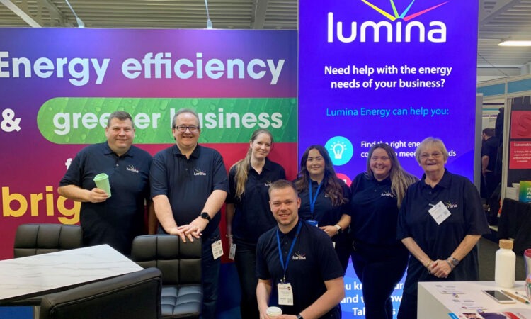 Some members of the Lumina Team standing in front of their exhibition stand at Business Vision Live in Kent, May 2023