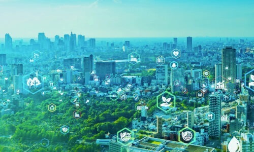 cityscape shot in hues of greens showing net zero related icons above buildings